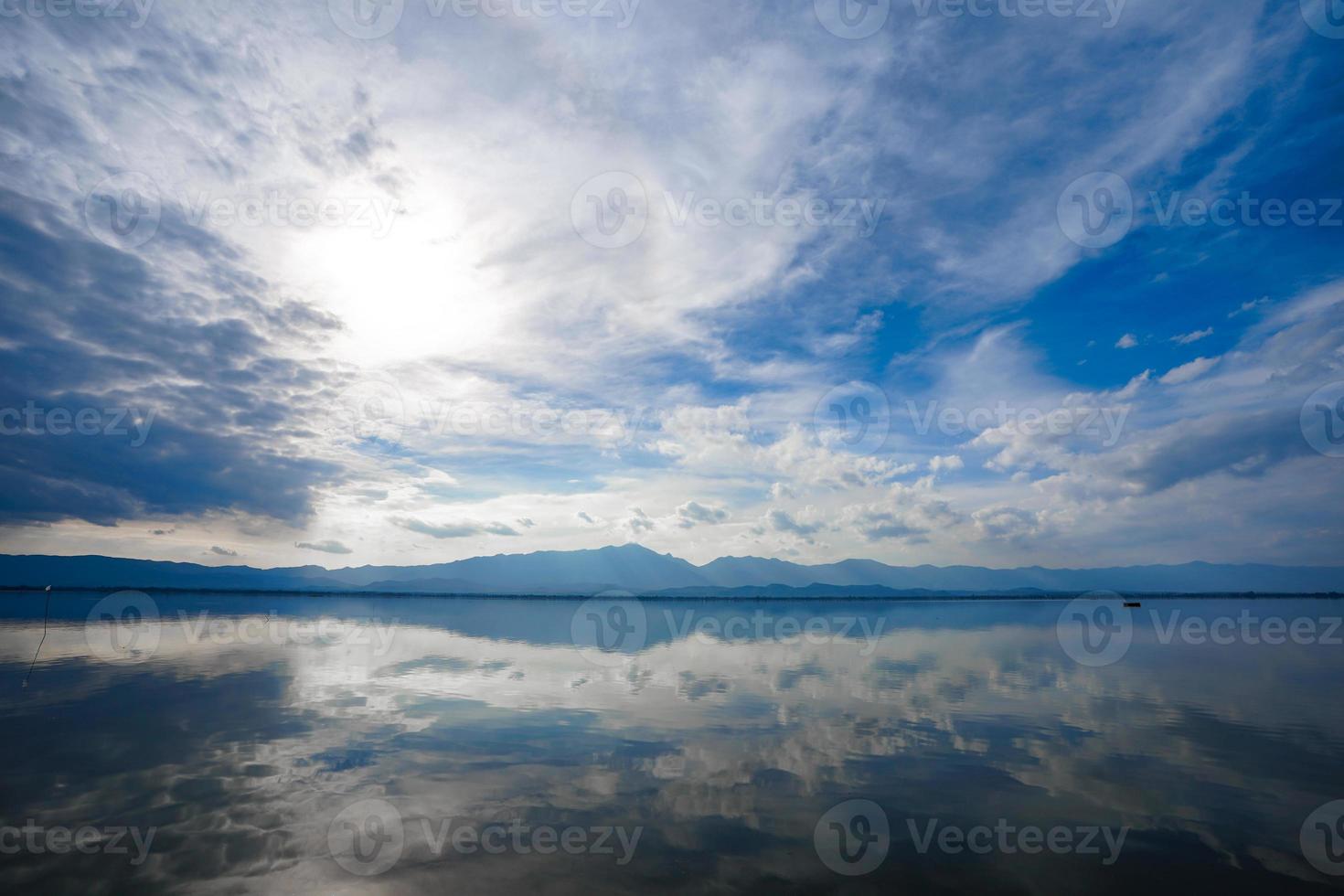 Kwan Phayao a lake in Phayao province, the North of Thailand. Shooting with the rule of thirds between river, cloud, and sky. photo