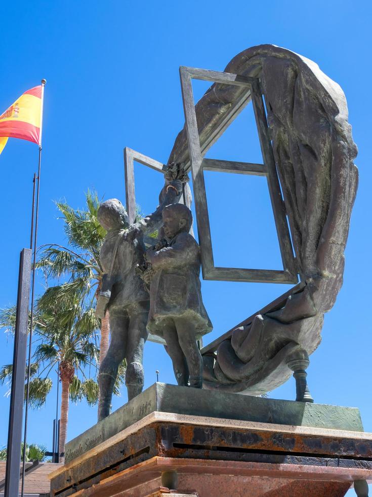 MARBELLA, ANDALUCIA, SPAIN, 2014. Boys and Window sculpture by Eduardo Soriano in Marbella Spain on May 4, 2014 photo