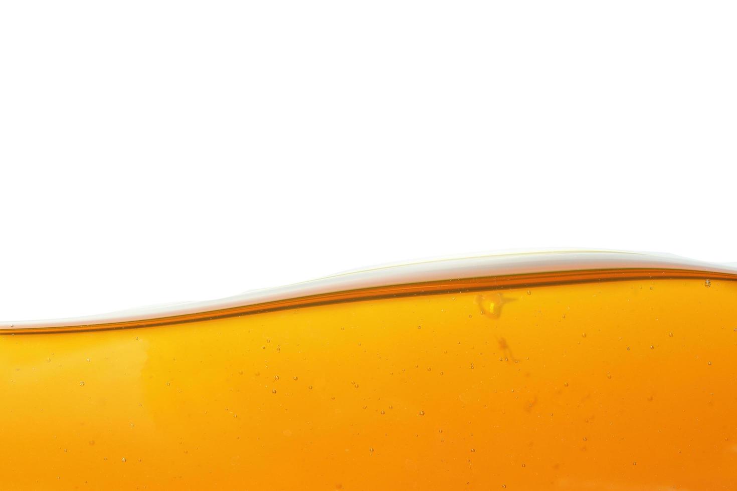 Wave of oil viscosity and air bubbles inside oil isolated on white background. photo