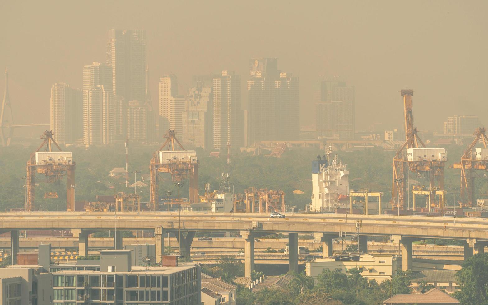 Blur photo of cityscape with polluted air. Air pollution. Smog and fine dust of pm 2.5 covered city. Dirty environment. Environmental problems. Toxic dust. Air pollution cause of lung cancer.