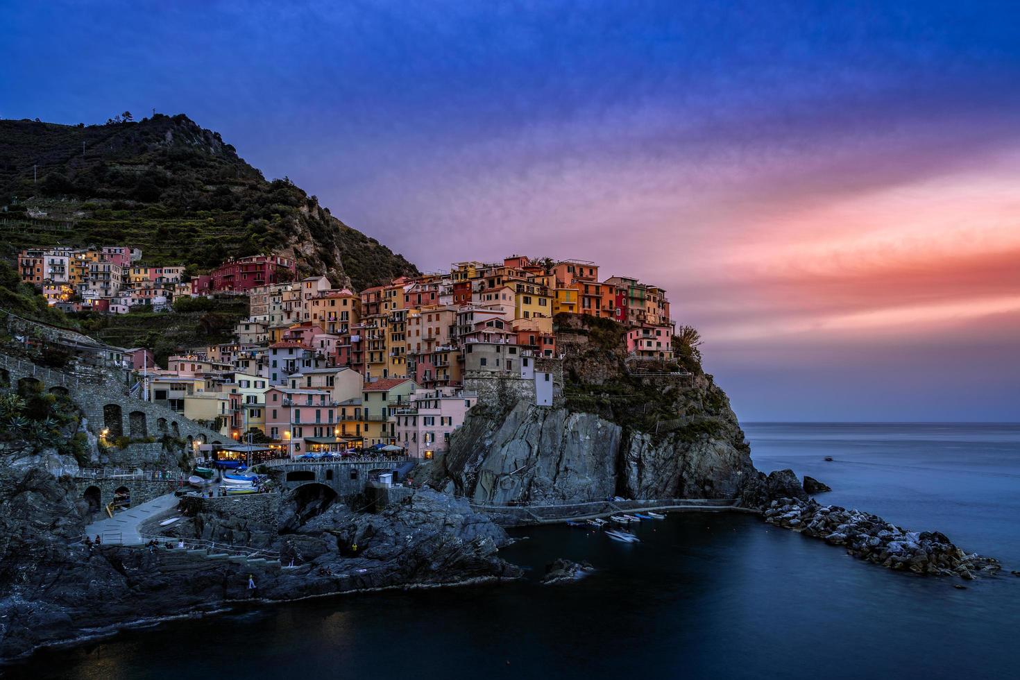 MANAROLA, LIGURIA, ITALY, 2019. Coastal view at dusk of Manarola Liguria Italy on April 20, 2019. Unidentified people photo