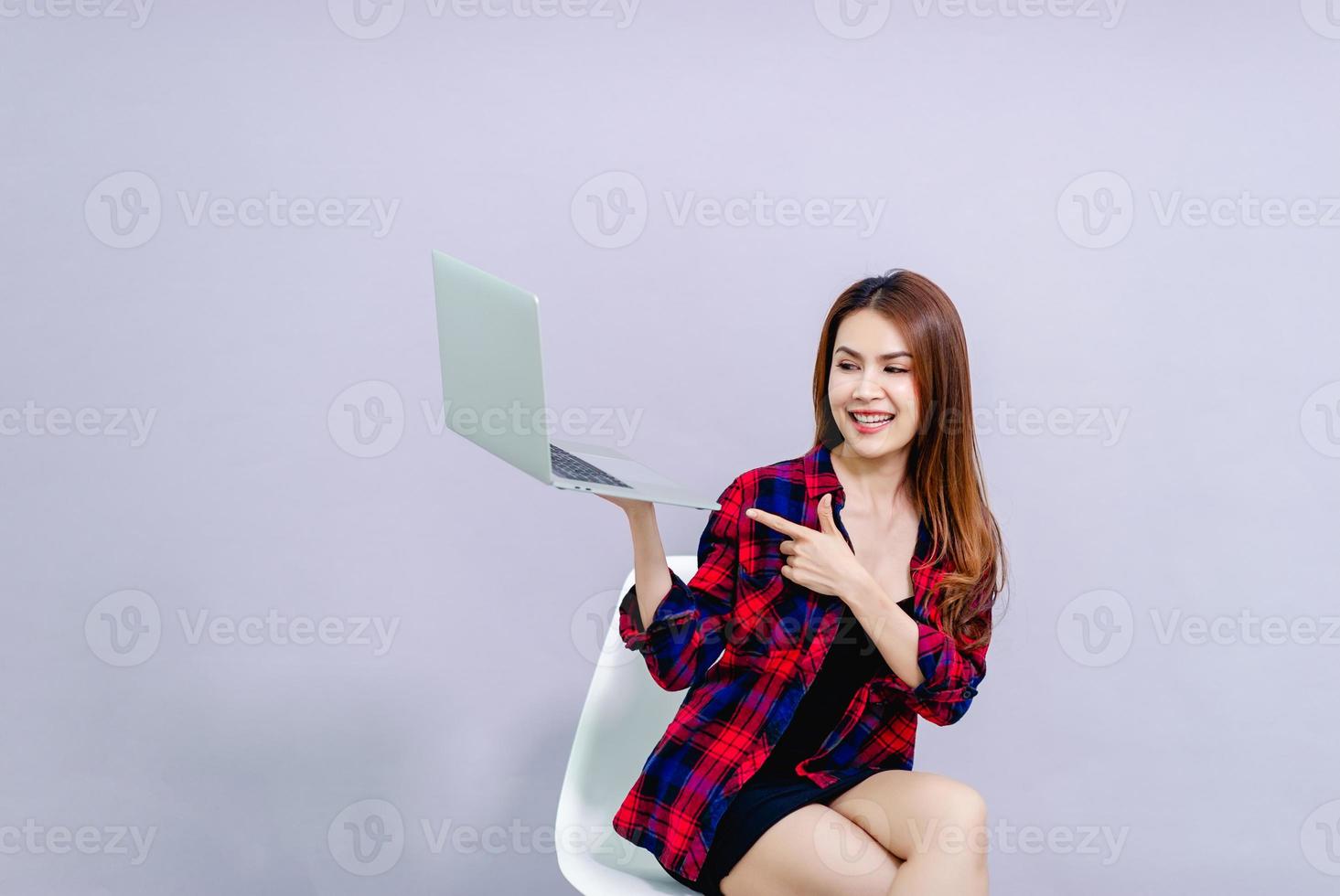 Women and laptops Sit happily at work The concept of running a smooth business. photo