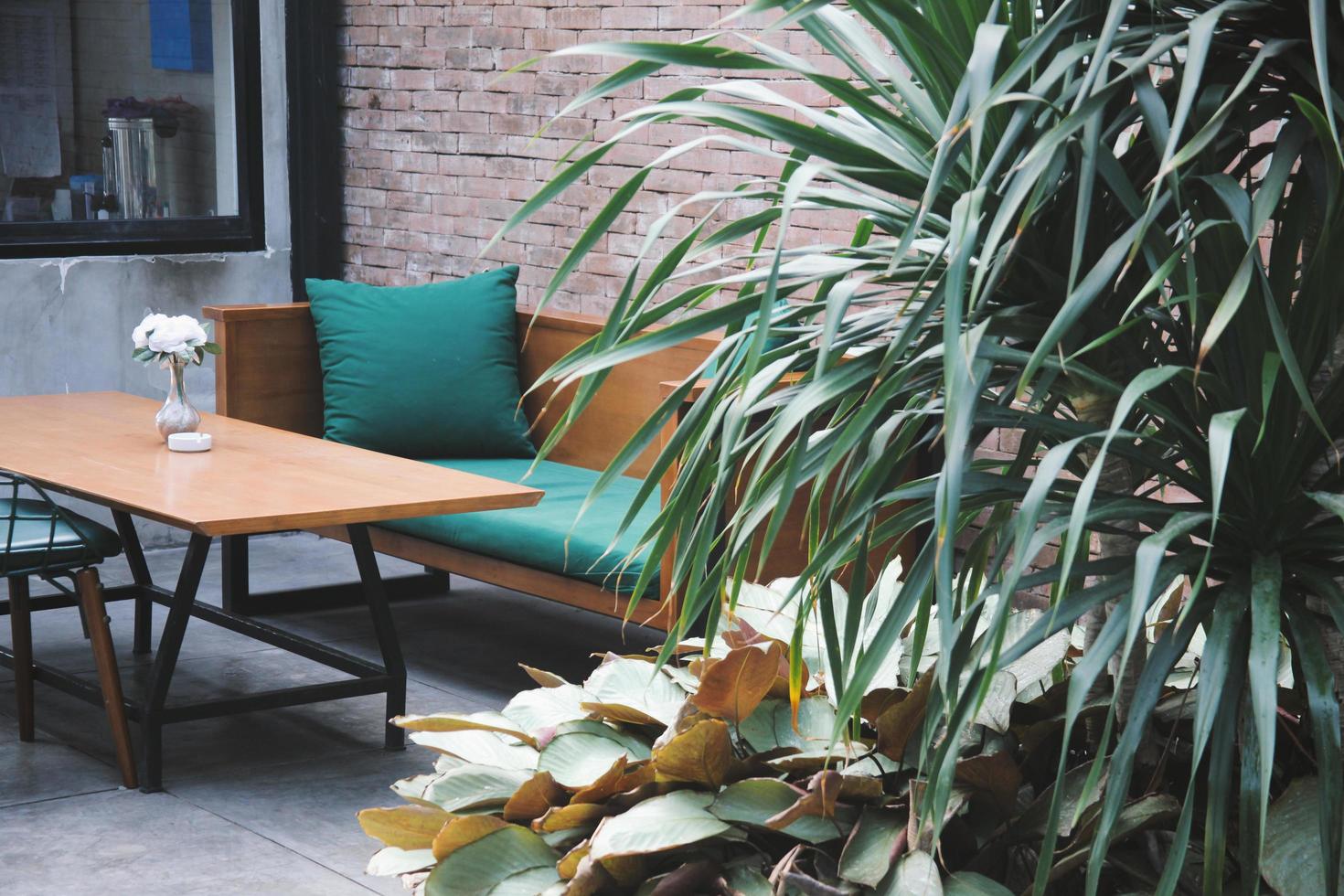 Close up Interior design for lounge with background brick wall with pot plant, minimalist design for modern living. Bandung, INDONESIA-MARCH 17, 2022 photo