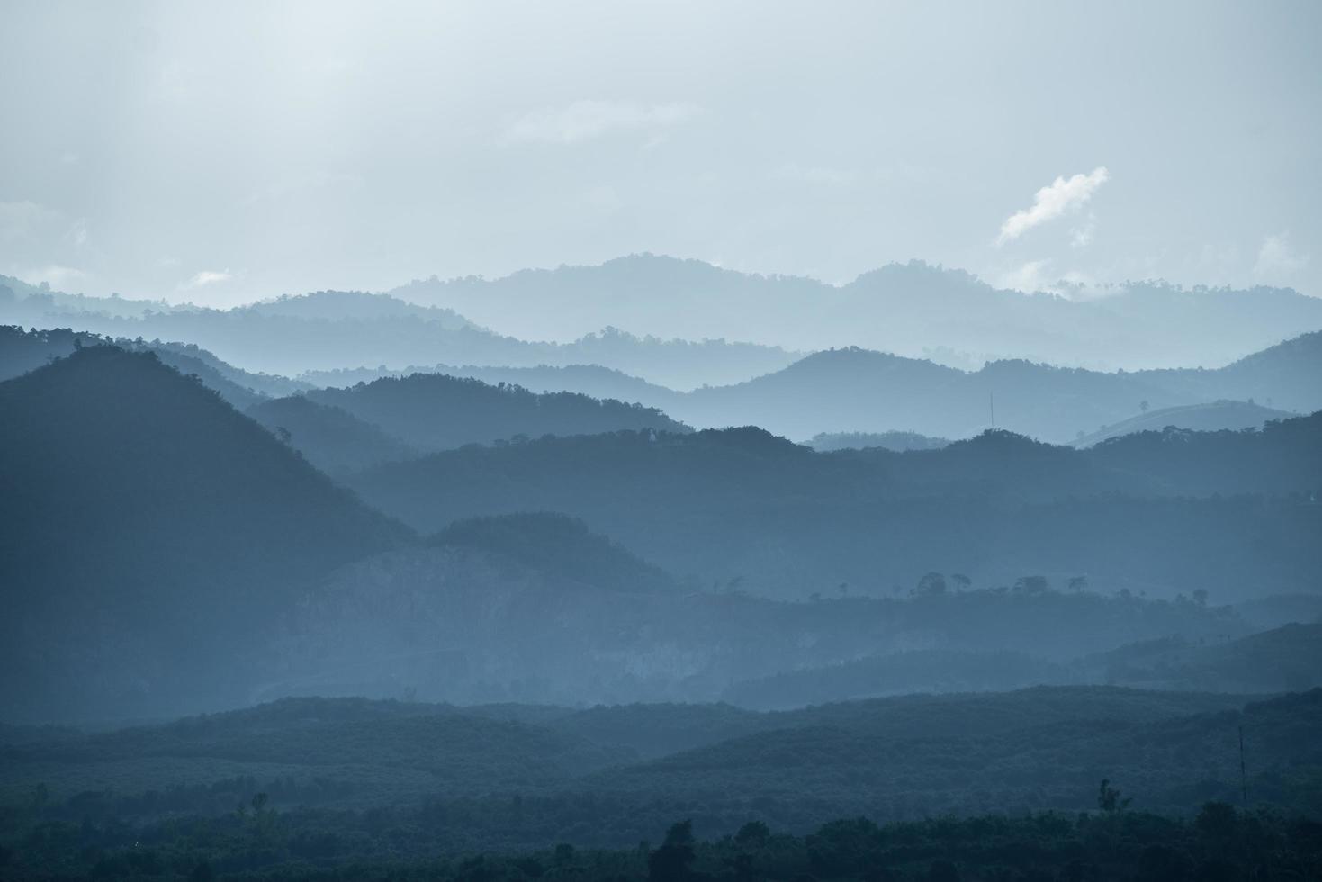 The mountains valley in the mist. Scenery view of the countryside of Chiang Rai province of Thailand. photo