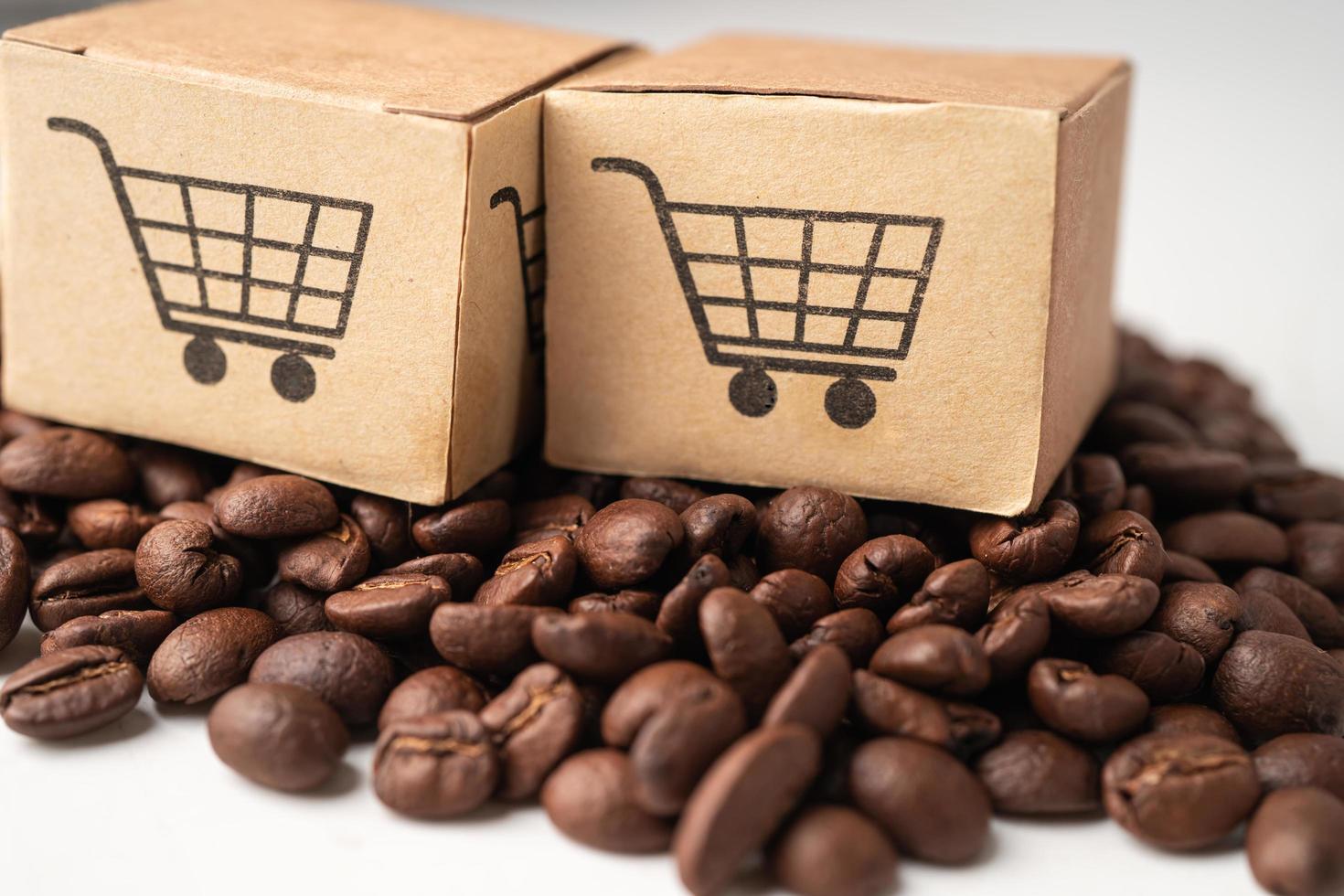 caja con el símbolo del logotipo del carrito de compras en granos de café, importación, exportación, compras en línea o servicio de entrega de comercio electrónico, envío de productos de tienda, comercio, concepto de proveedor. foto