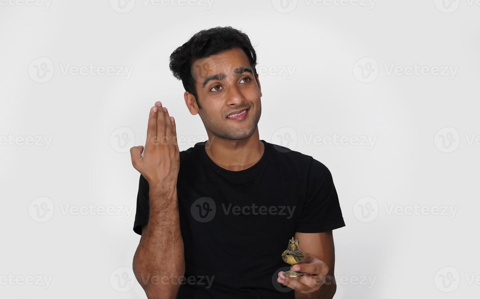 A man having magical jinee lamp and happy photo