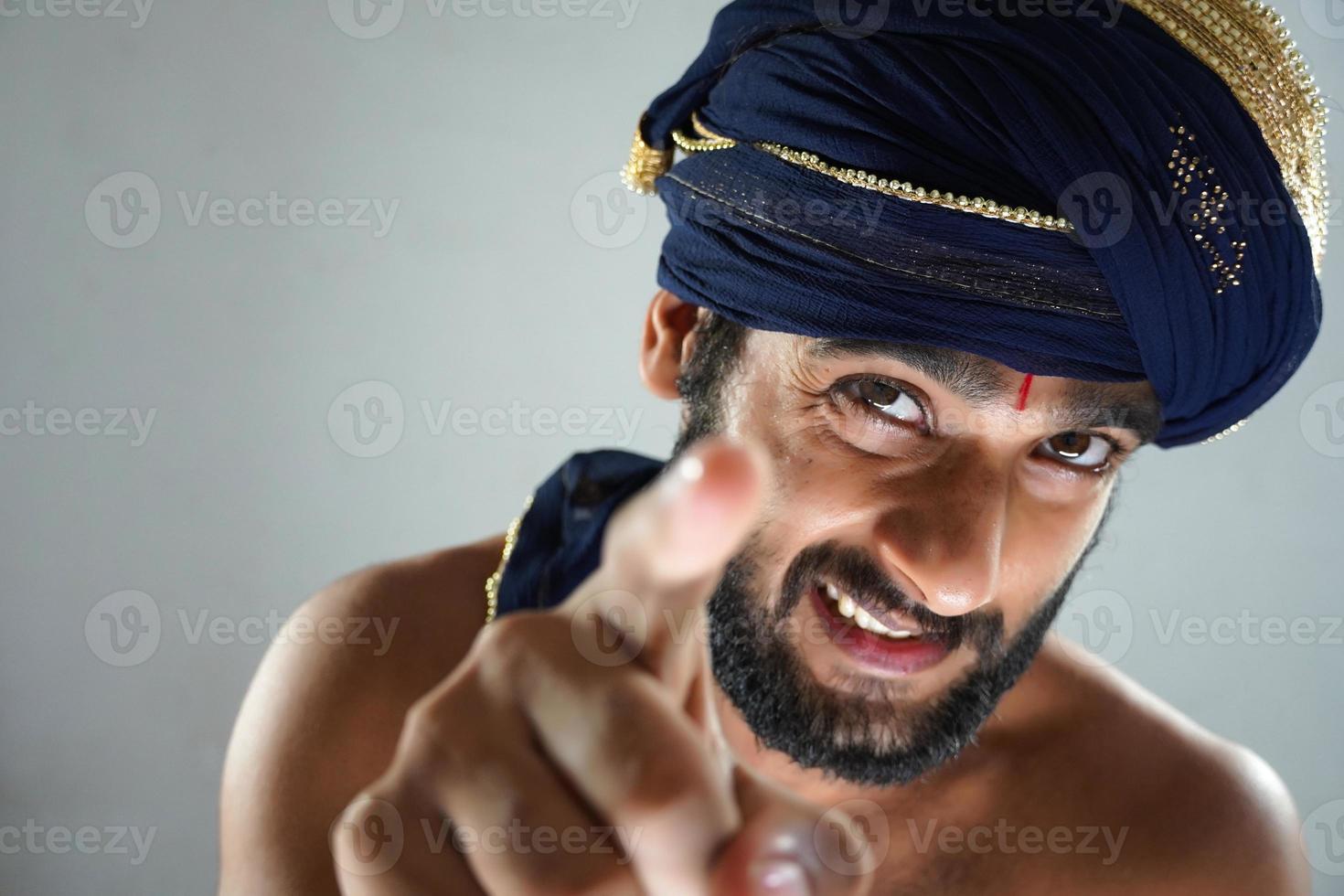 indian King telling you are responcible - indian man in Theater acting as a king photo