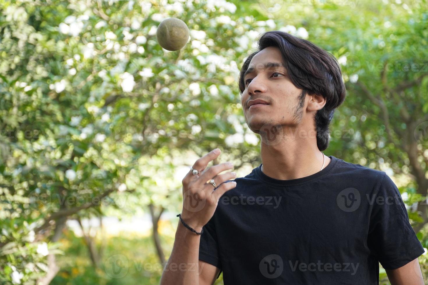 a Boy caughting cricket ball photo