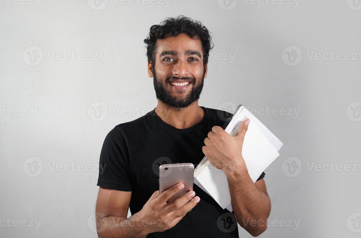 adult, background, beard, cheerful, drink, expression, face, guy, handsome, happiness, happy, hispanic, holding, isolated, joy, male, man, person, portrait, positive, smile, tea, white, young photo