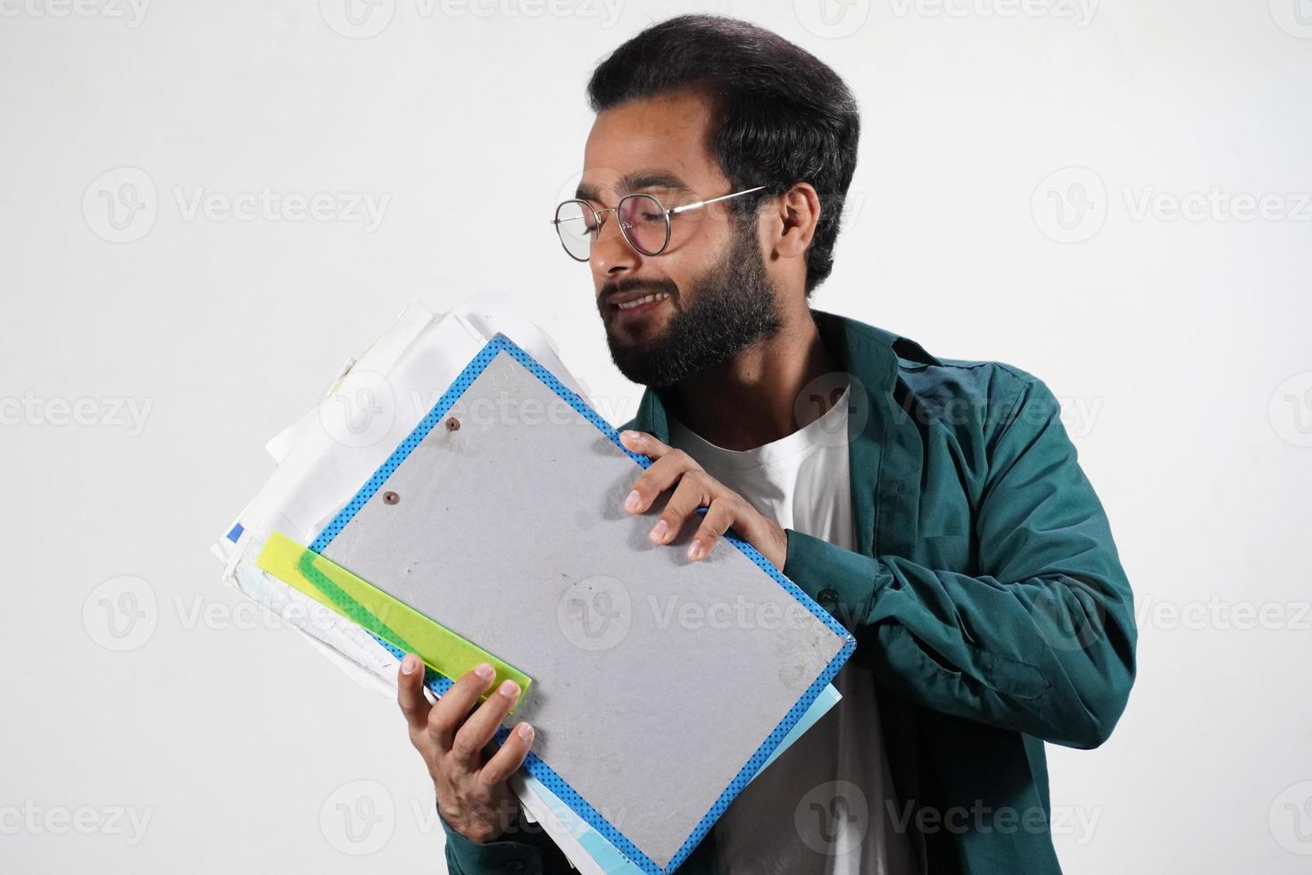 A Young man with Book and note books - Education Concept , in white background photo
