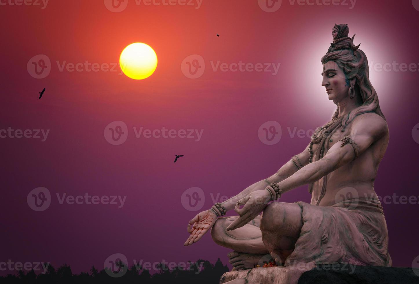 Hindu god Shiva sculpture sitting in meditation photo