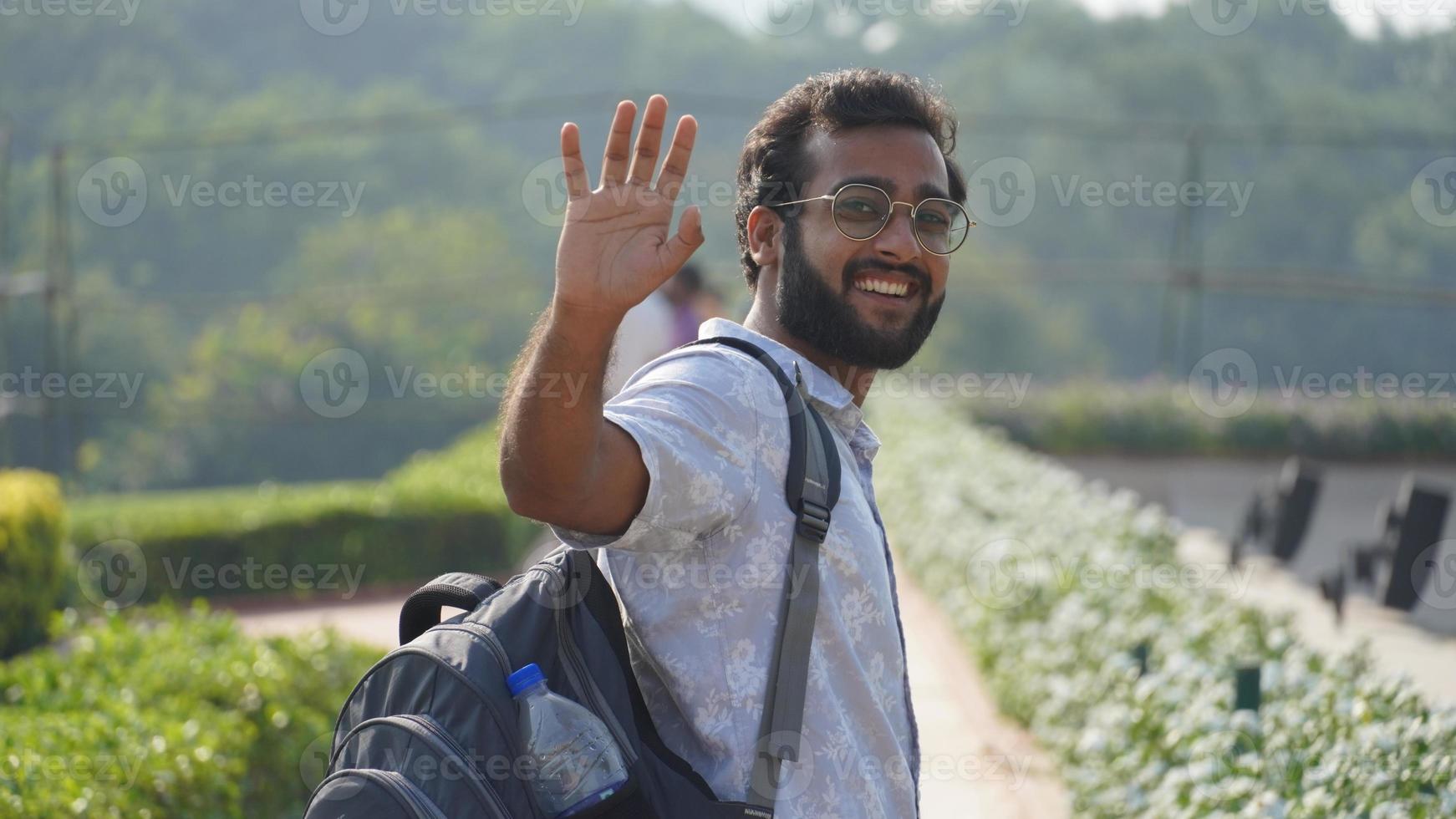 a man SAYING HI image photo