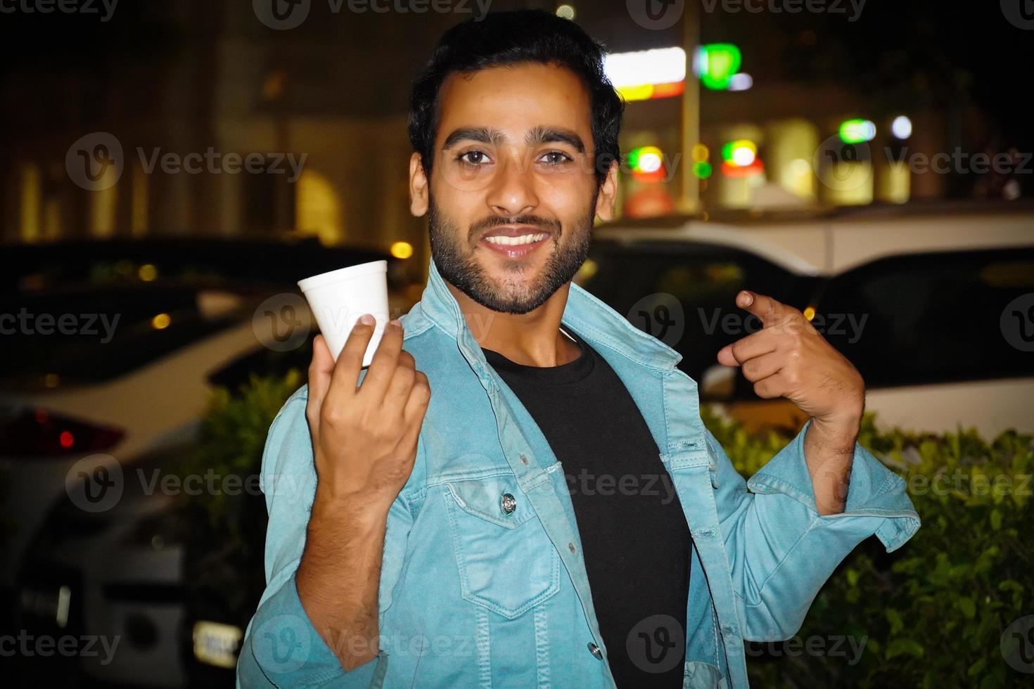 Asian man having a tea cup enjoying evening tea photo