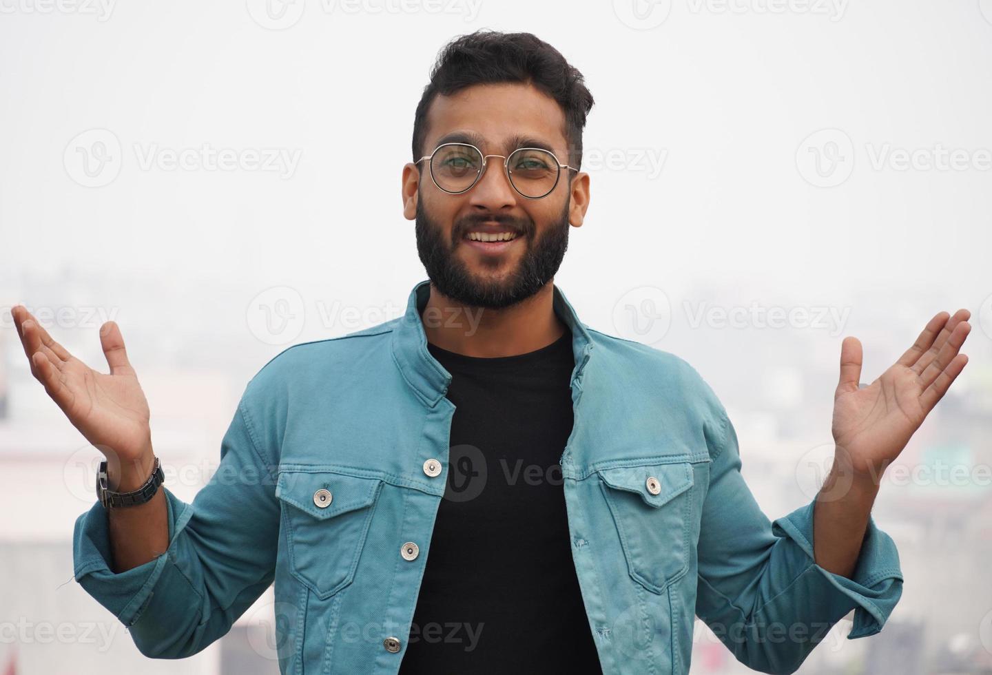 a man showing nice sign using hand photo