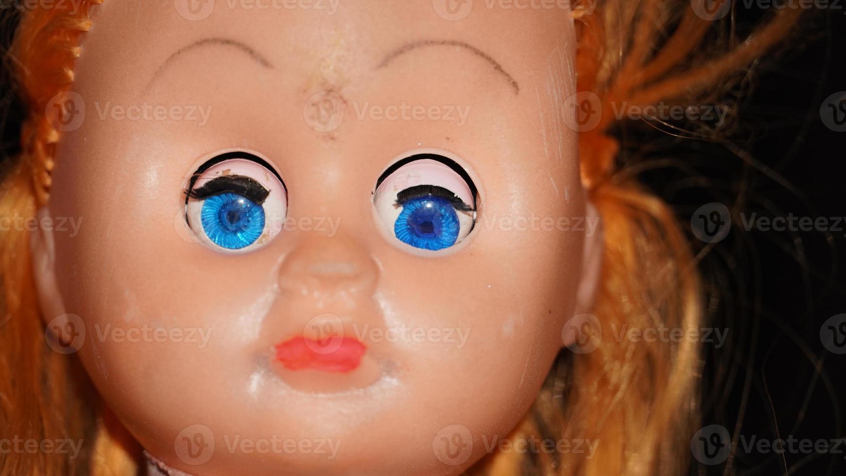 a toy face with beautiful eye image photo