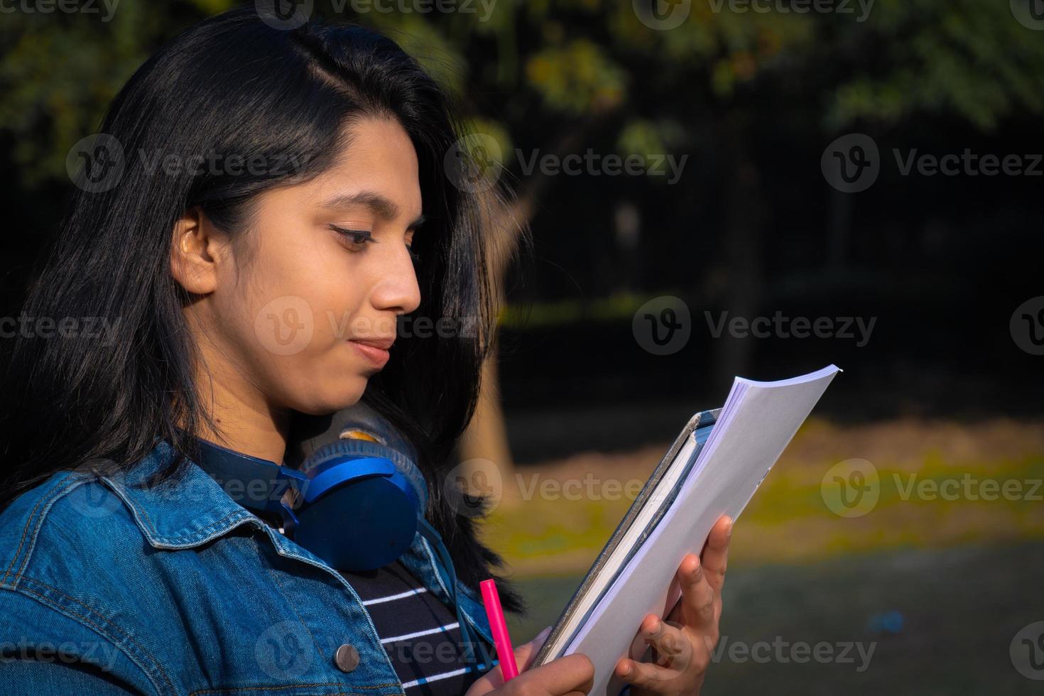 Indian girl reading book image Indian girl photo