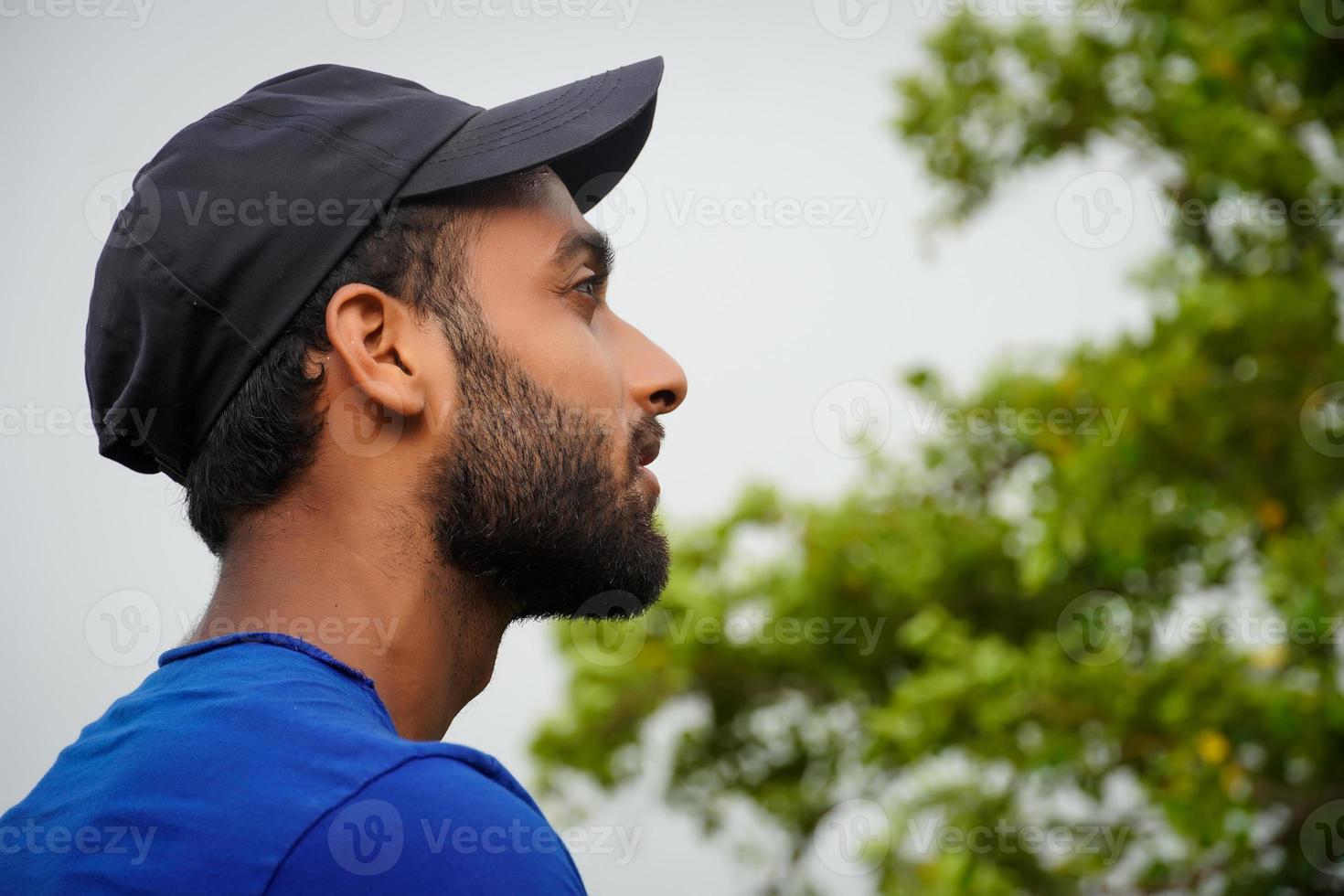 a young man watching nature and thinking photo