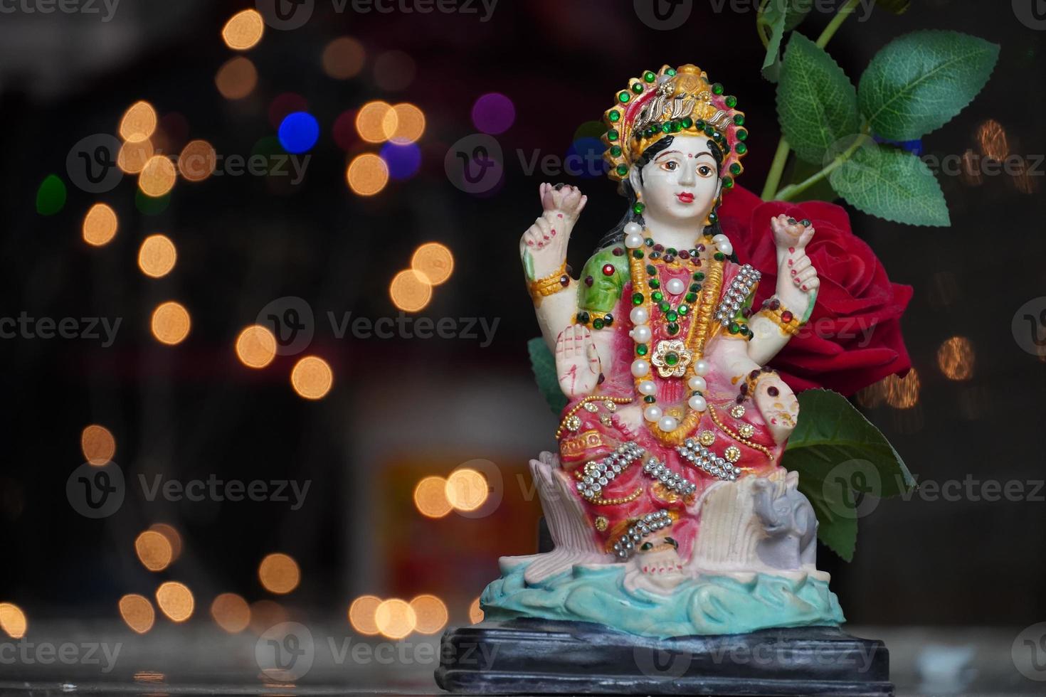 laxmi devi wallpaper with red rose image HD photo