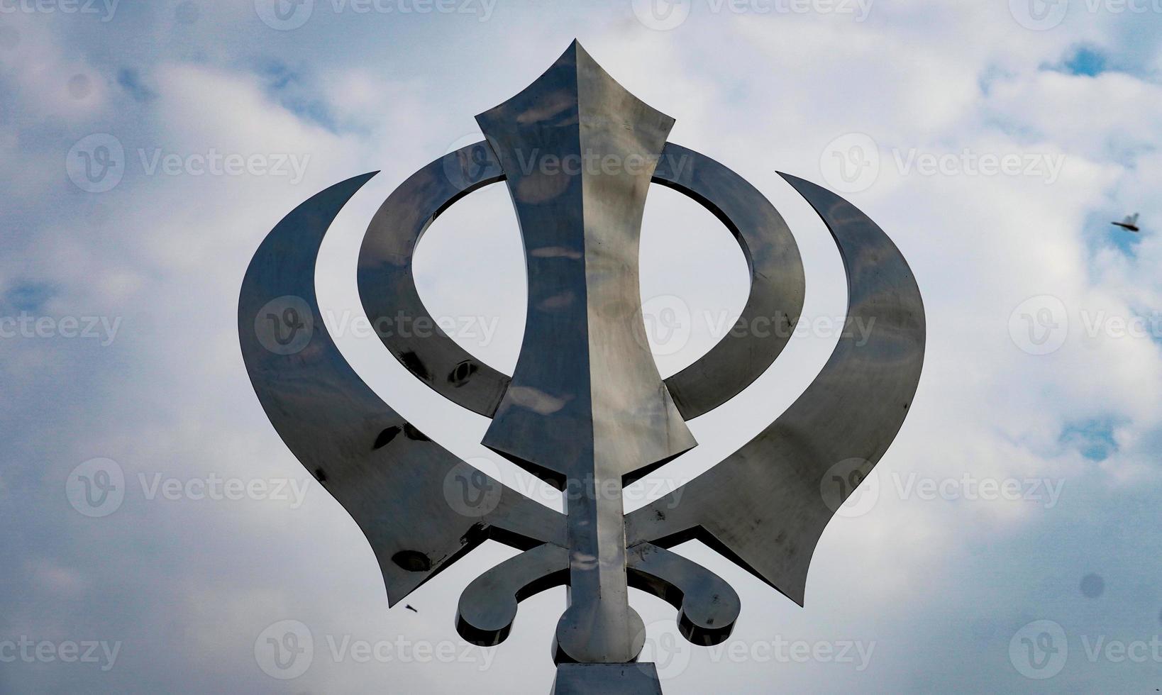 sikhism symbol khanda image in sky photo