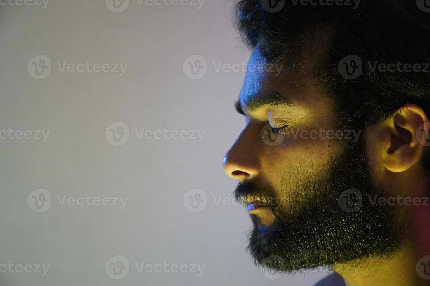 a young man crying alone and sad face photo