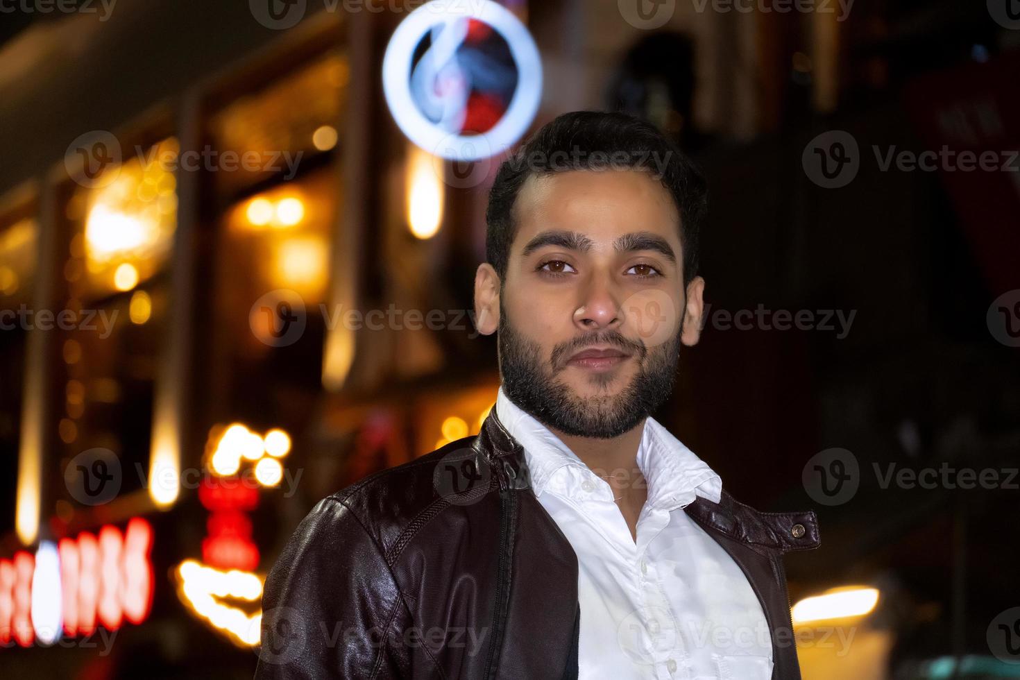 Asian man watching camera in night night portrait photography photo