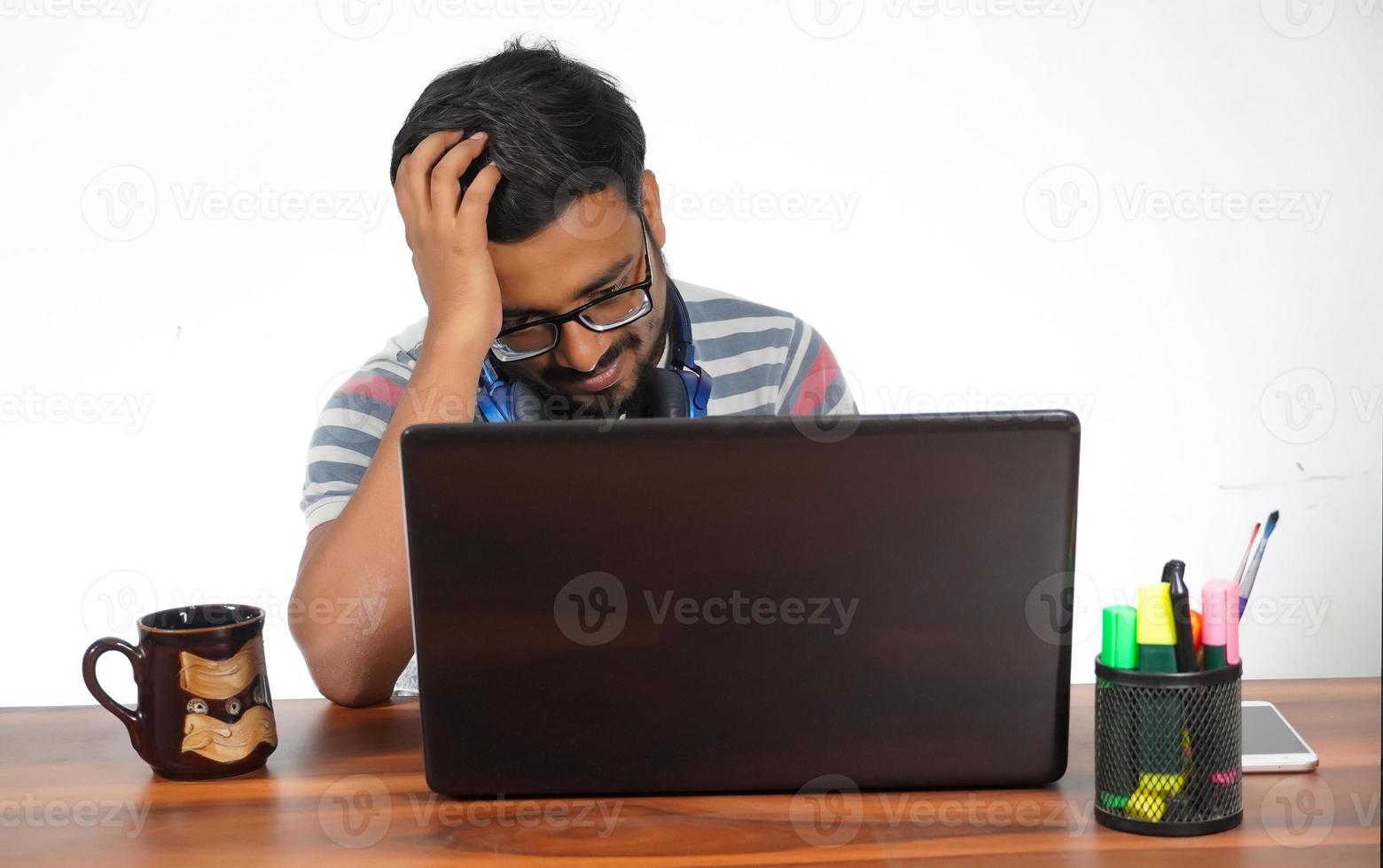 Frustrated man on due to job work photo