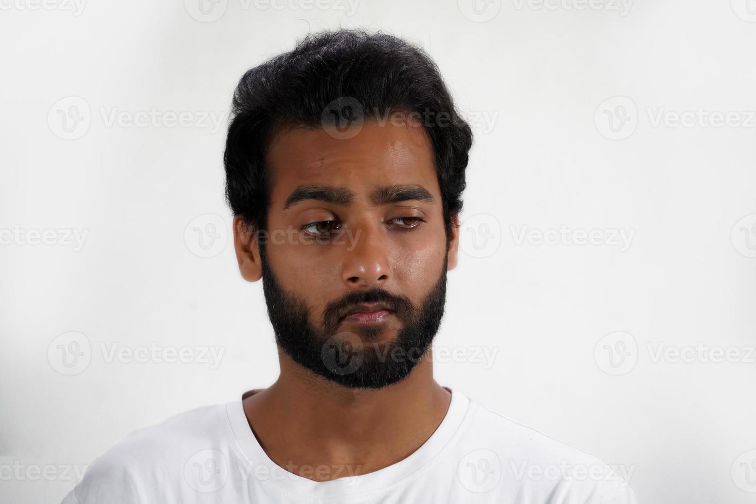 A Sad young Man portrait in white background photo