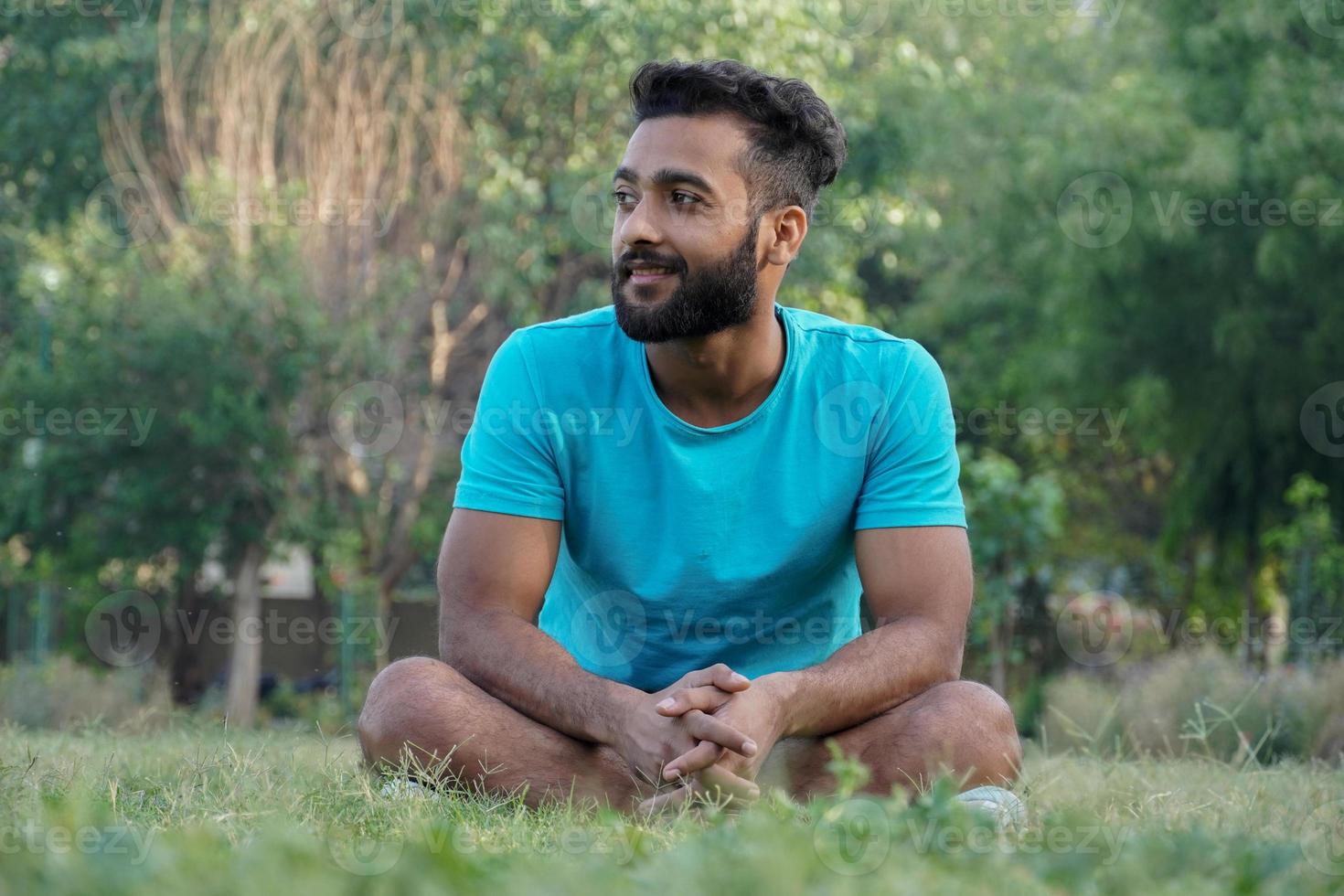 a man in park after yoga smiles photo