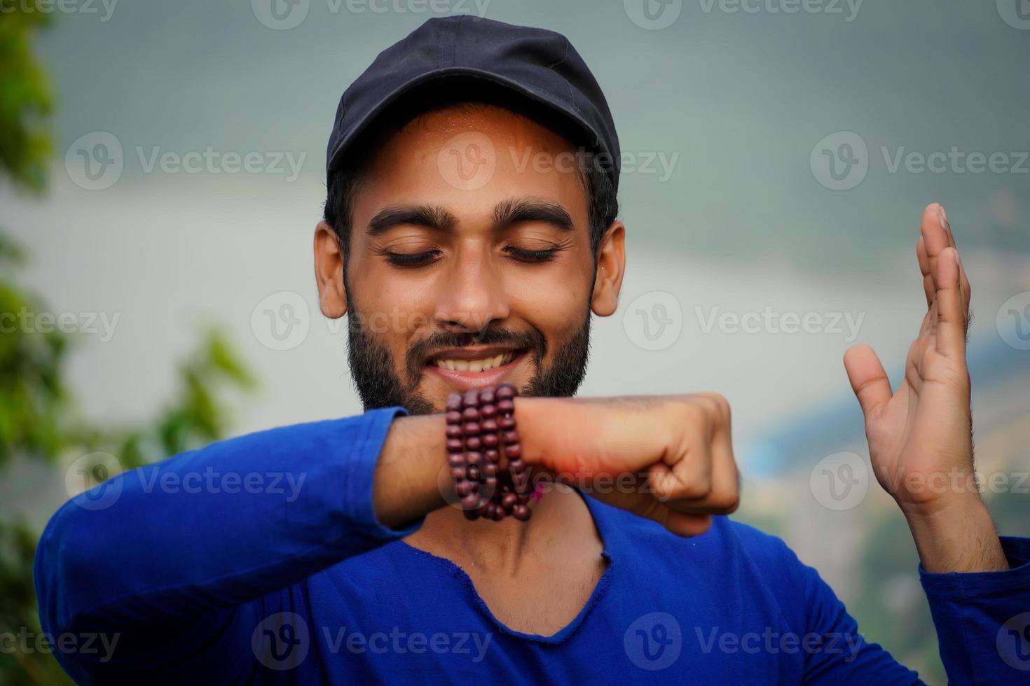 young man showing his hand and making wish photo