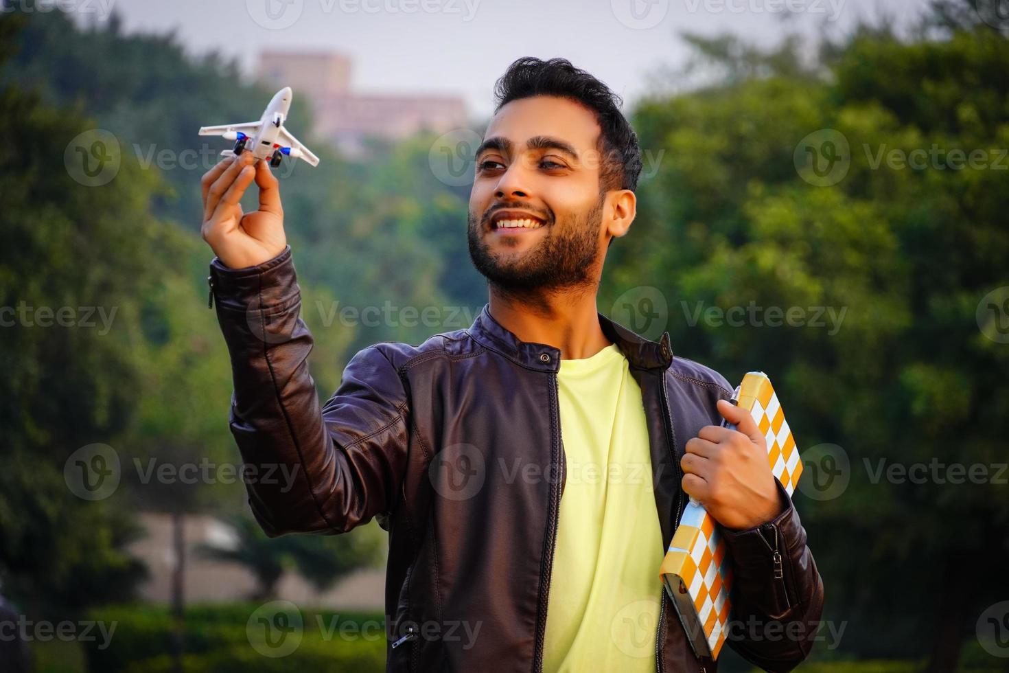 Boy having aeroplane and try to fly photo