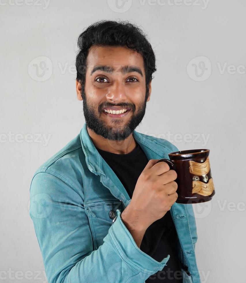 a man with a coffee cup photo