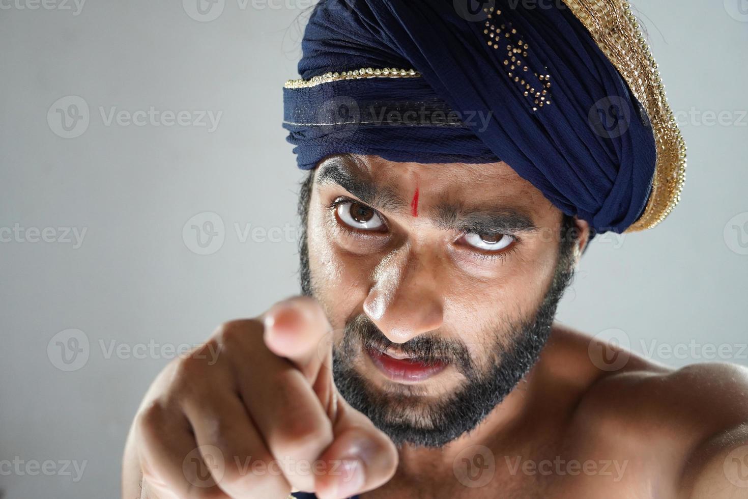 indian King telling you are responcible - indian man in Theater acting as a king photo