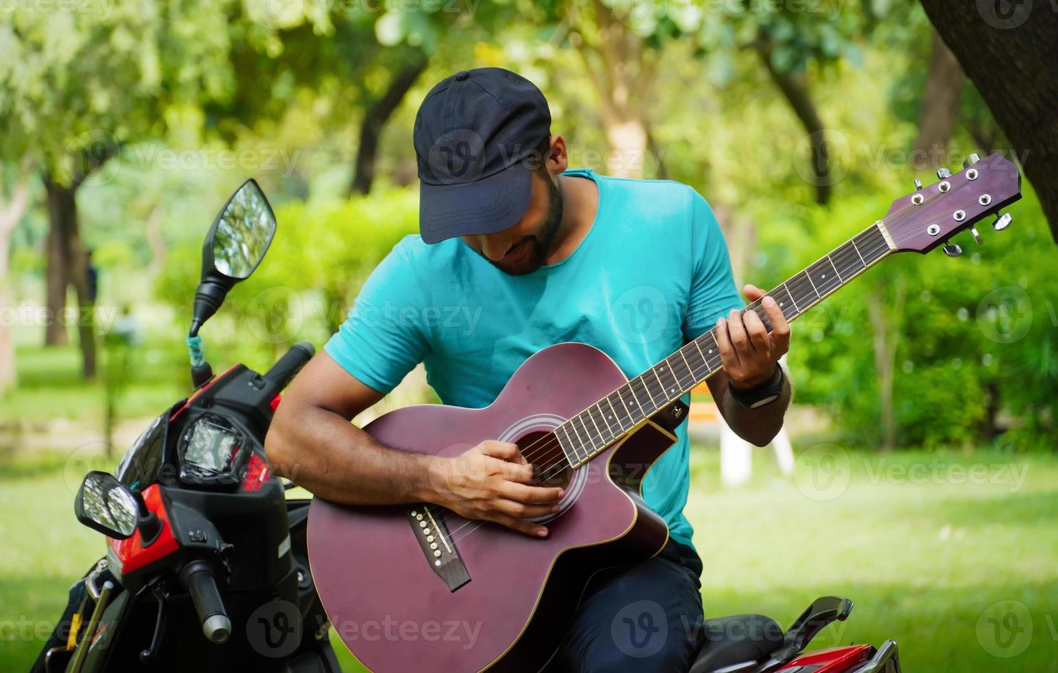 man with red guitar image photo