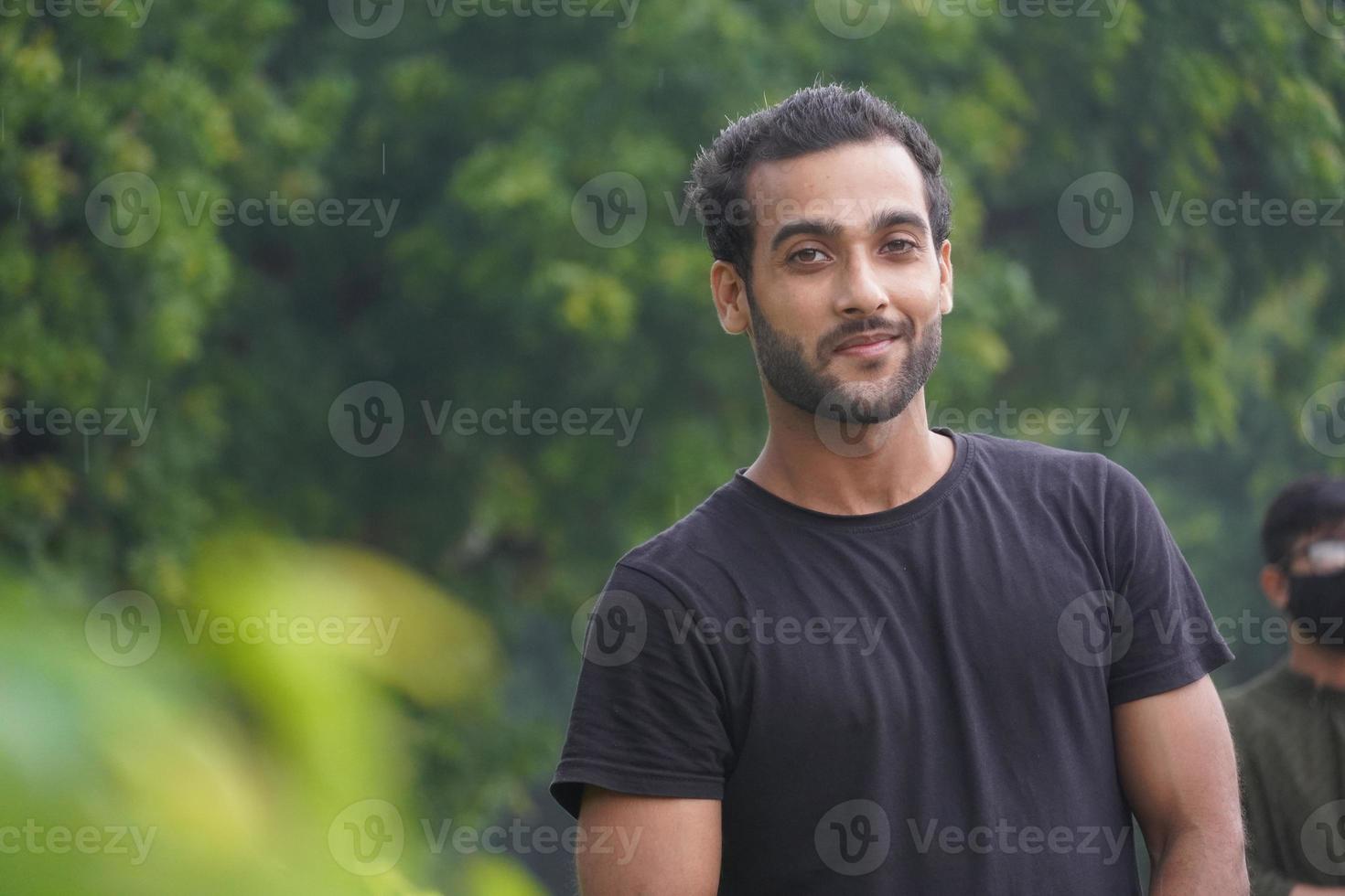 handsome man in park at outdoor photo