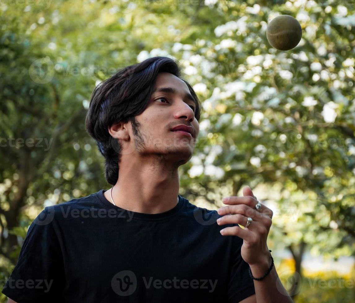 man catching cricket ball photo