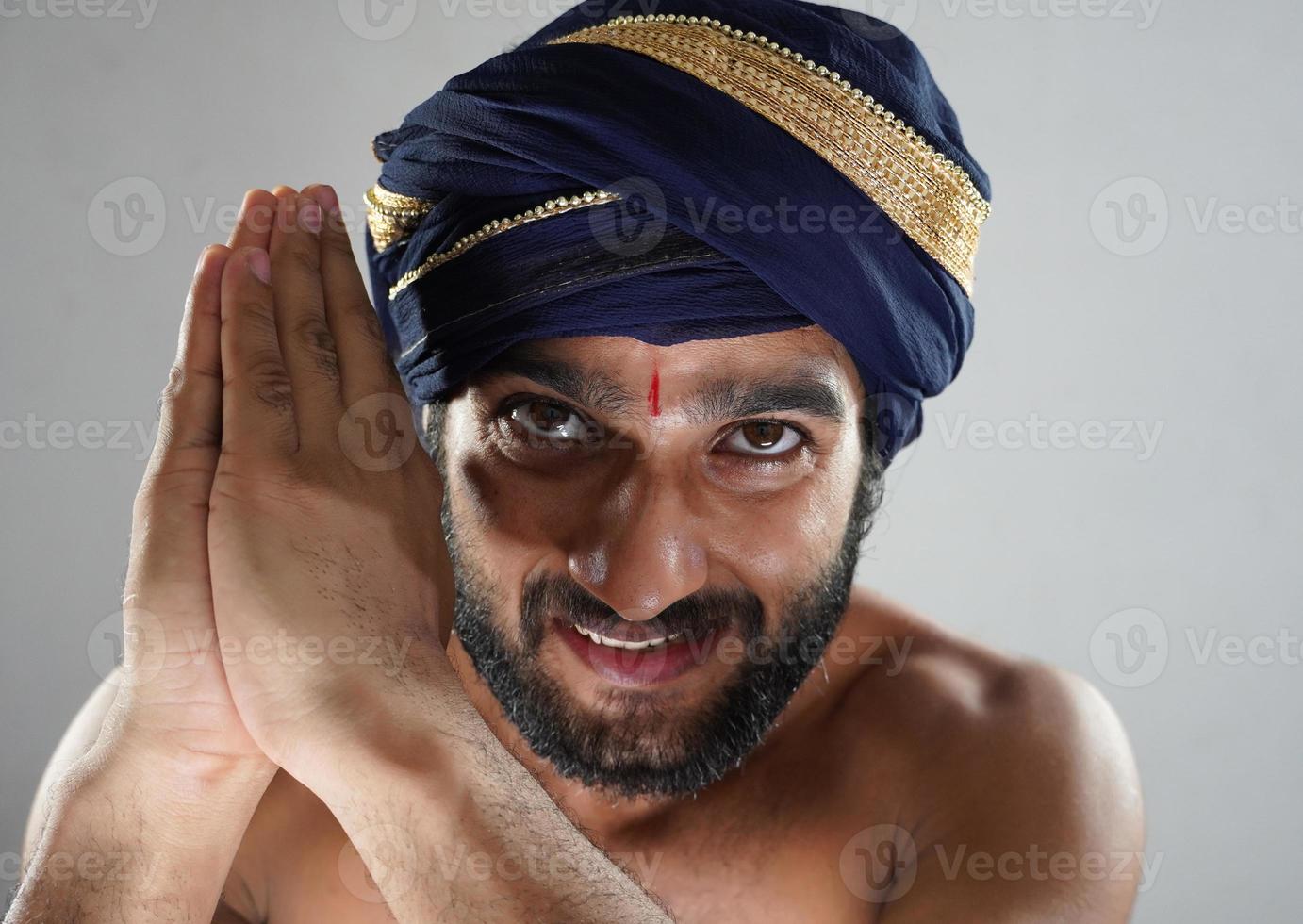hindu king doing namskkar king images - indian man in Theater acting as a king photo