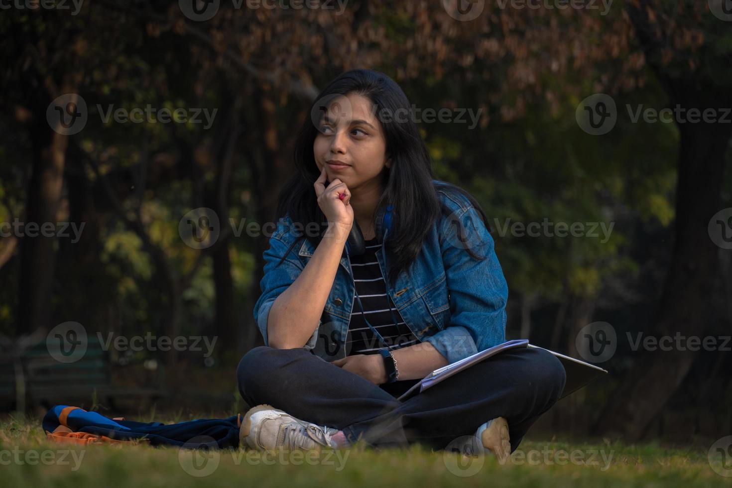 Girl in thinking at college campus photo