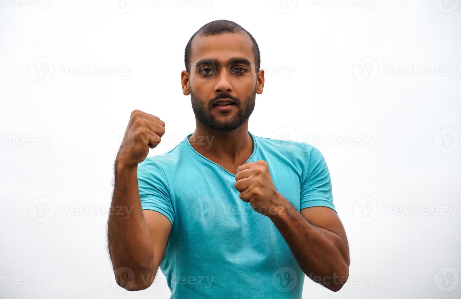 a man standing and showing punch photo