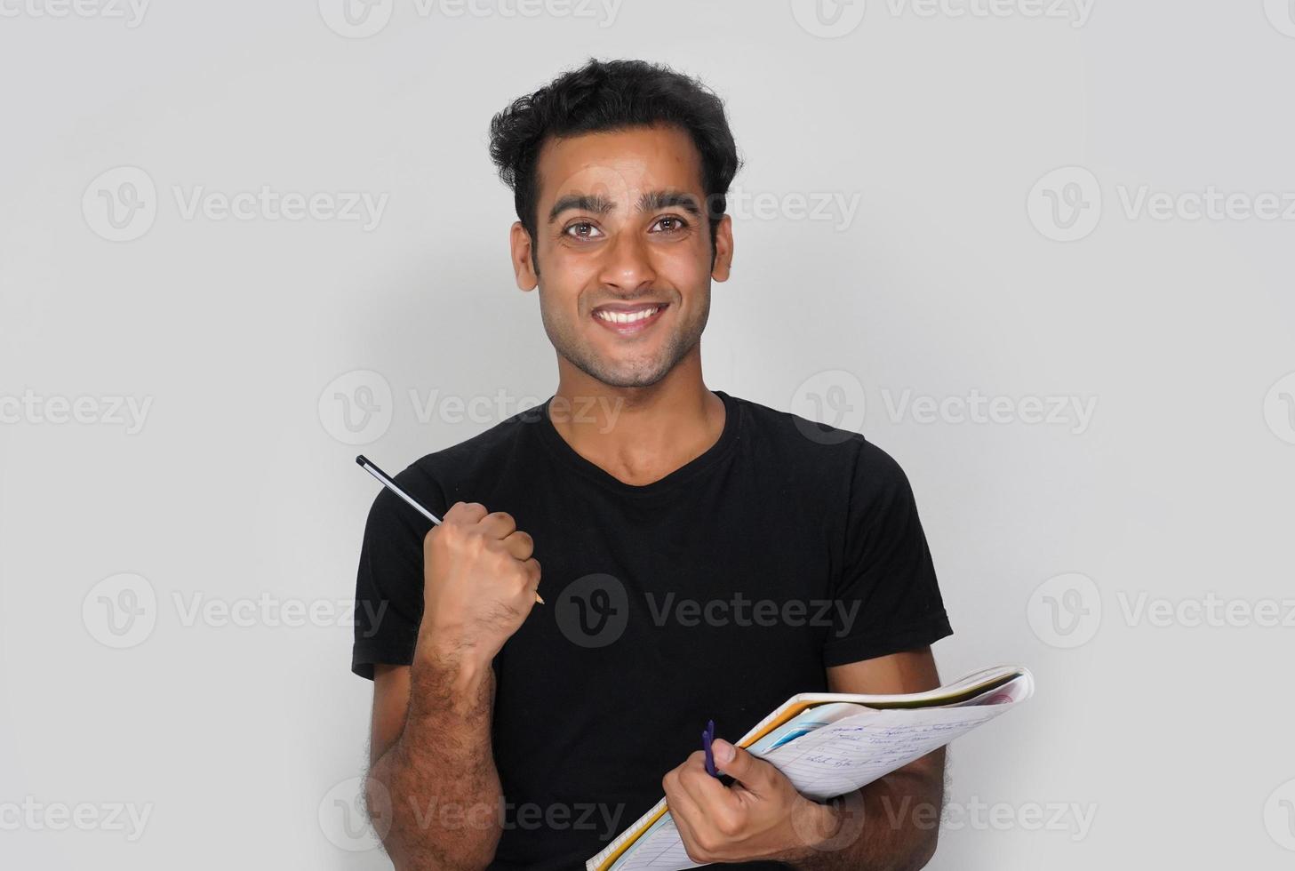 A Happy Student With Books and Pencil - Education Concept photo