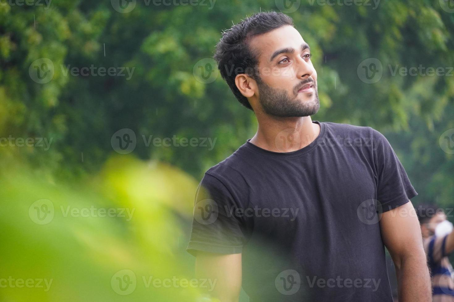 handsome man in park at outdoor photo