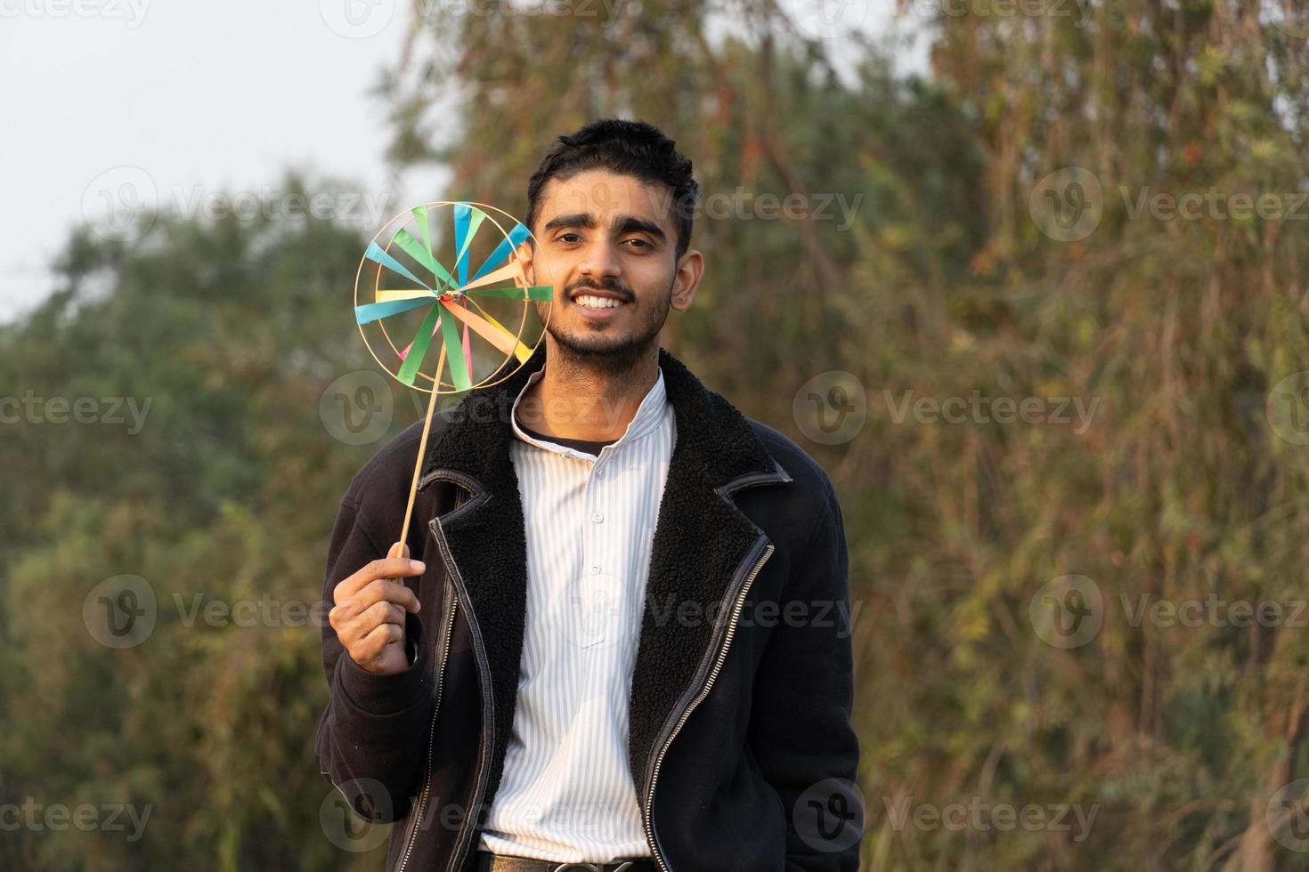 Young boy with Indian handmade toy photo