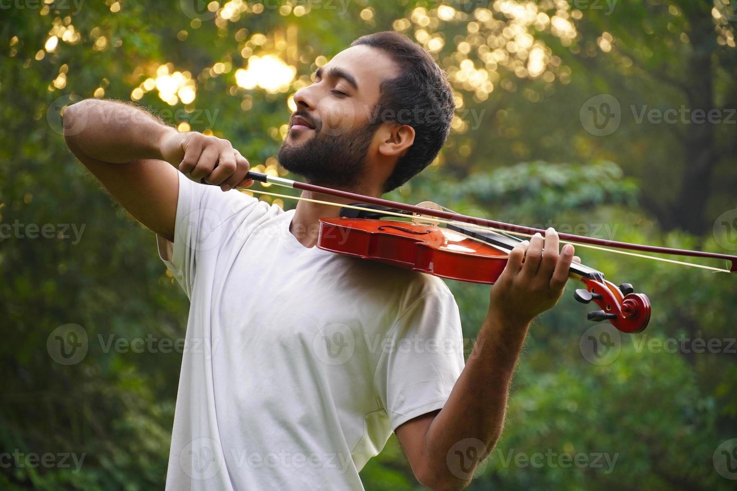 musician playing violin. Music and musical tone concept. photo