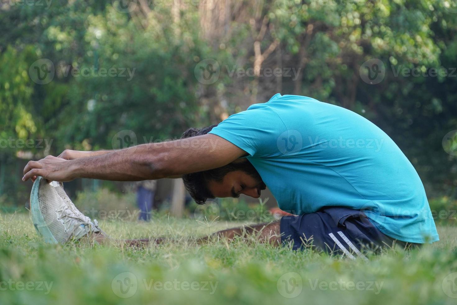 Young man at Park in Morning doing exrersise photo