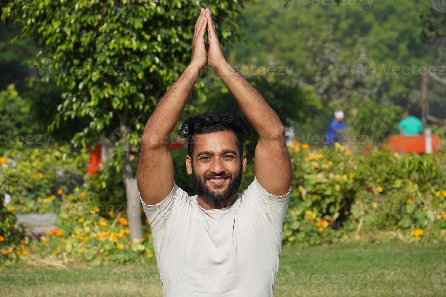 a man doing saurayanamaskaar yoga photo