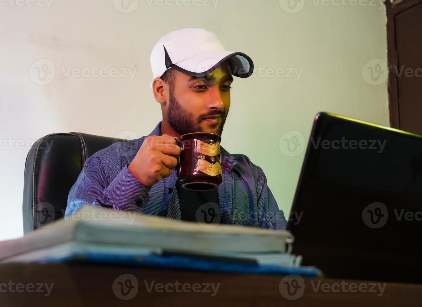 businessman doing business USING HIS LAPTOP photo