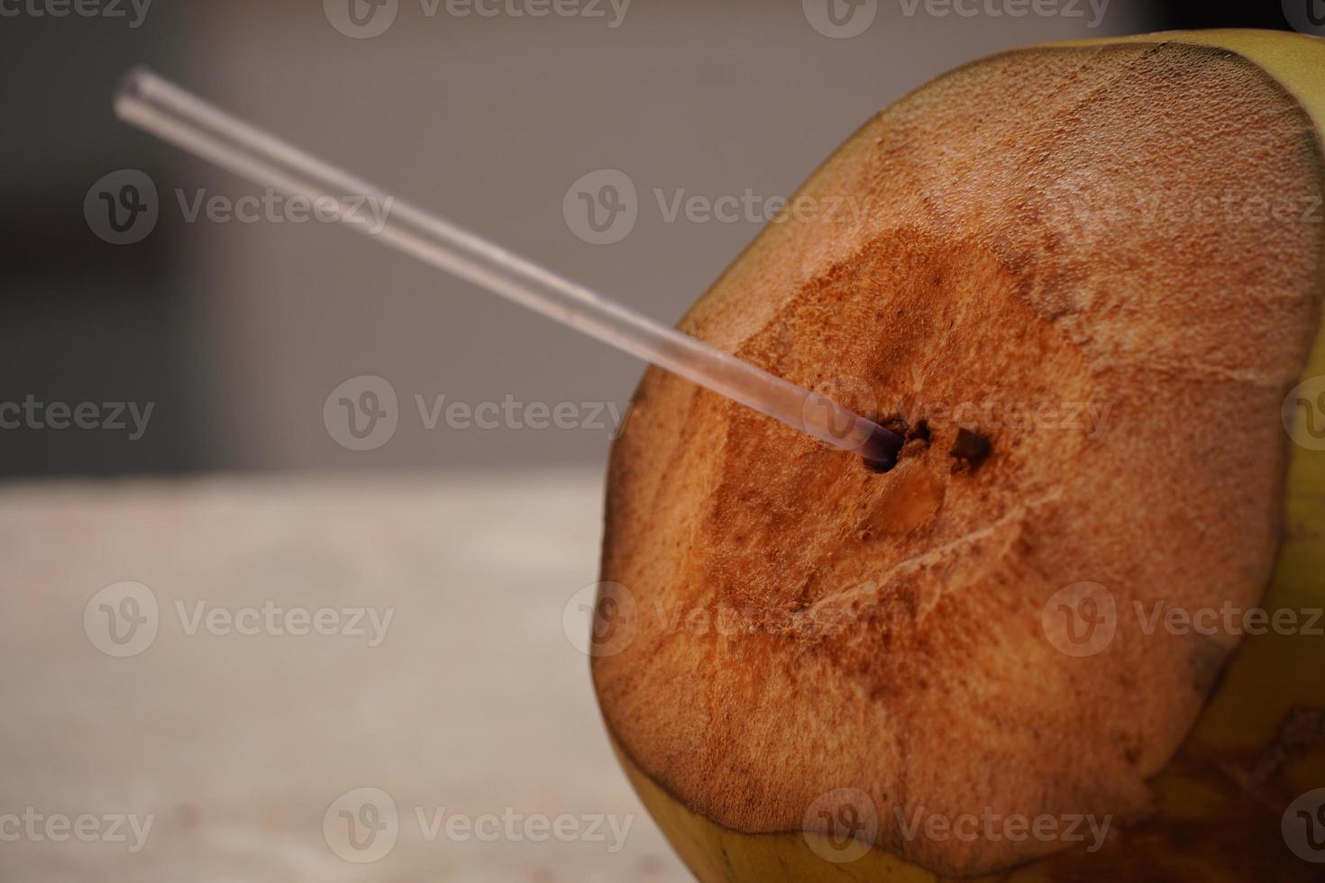 closeup of green coconut water straw images photo