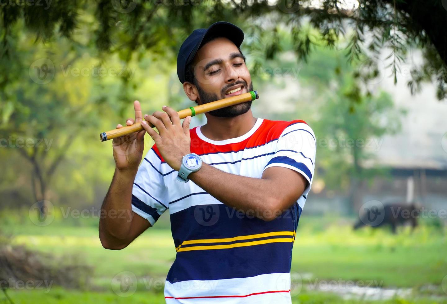 playing bansuri flute indian wind instrument photo