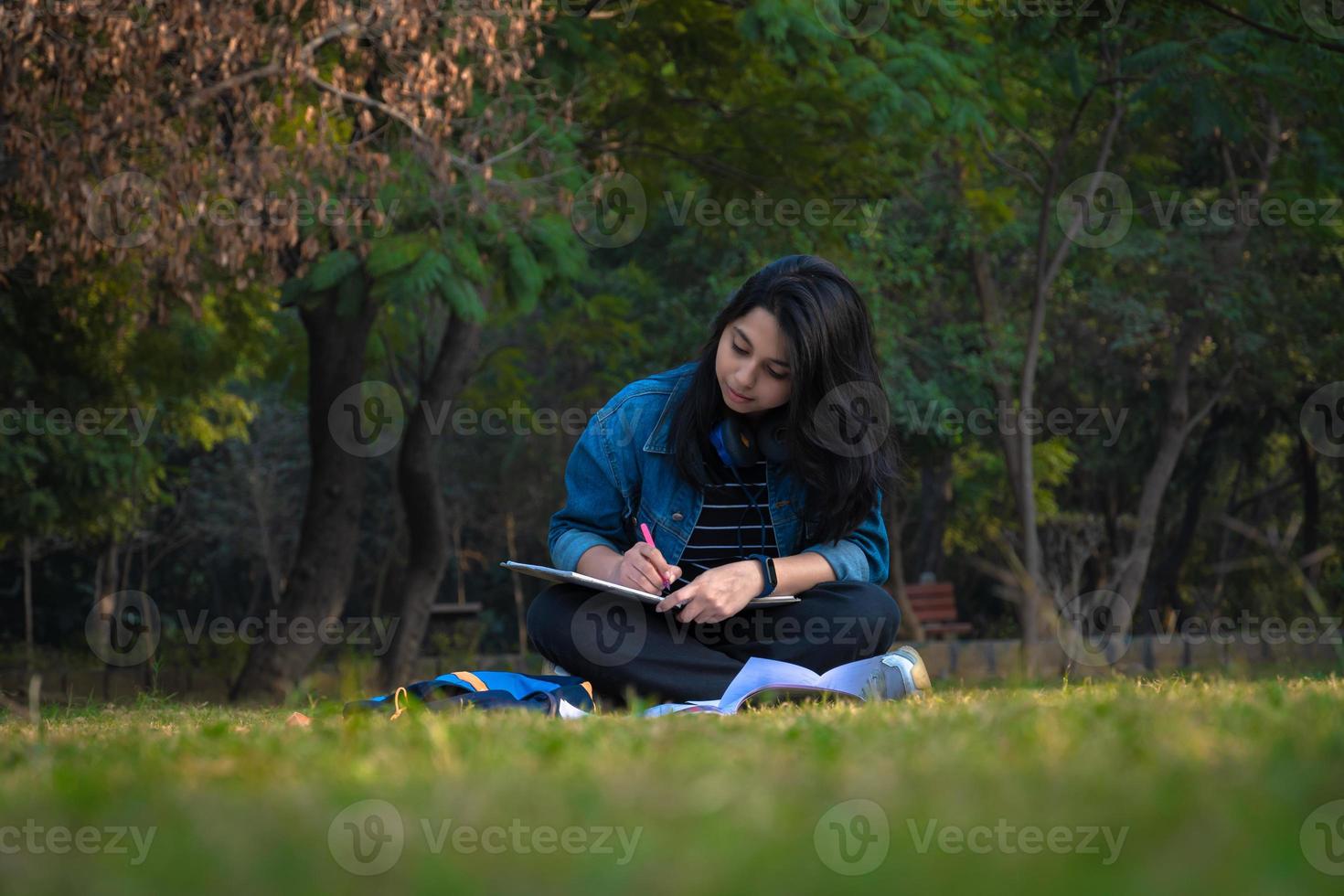 Studying image of a Indian girl near college campus photo