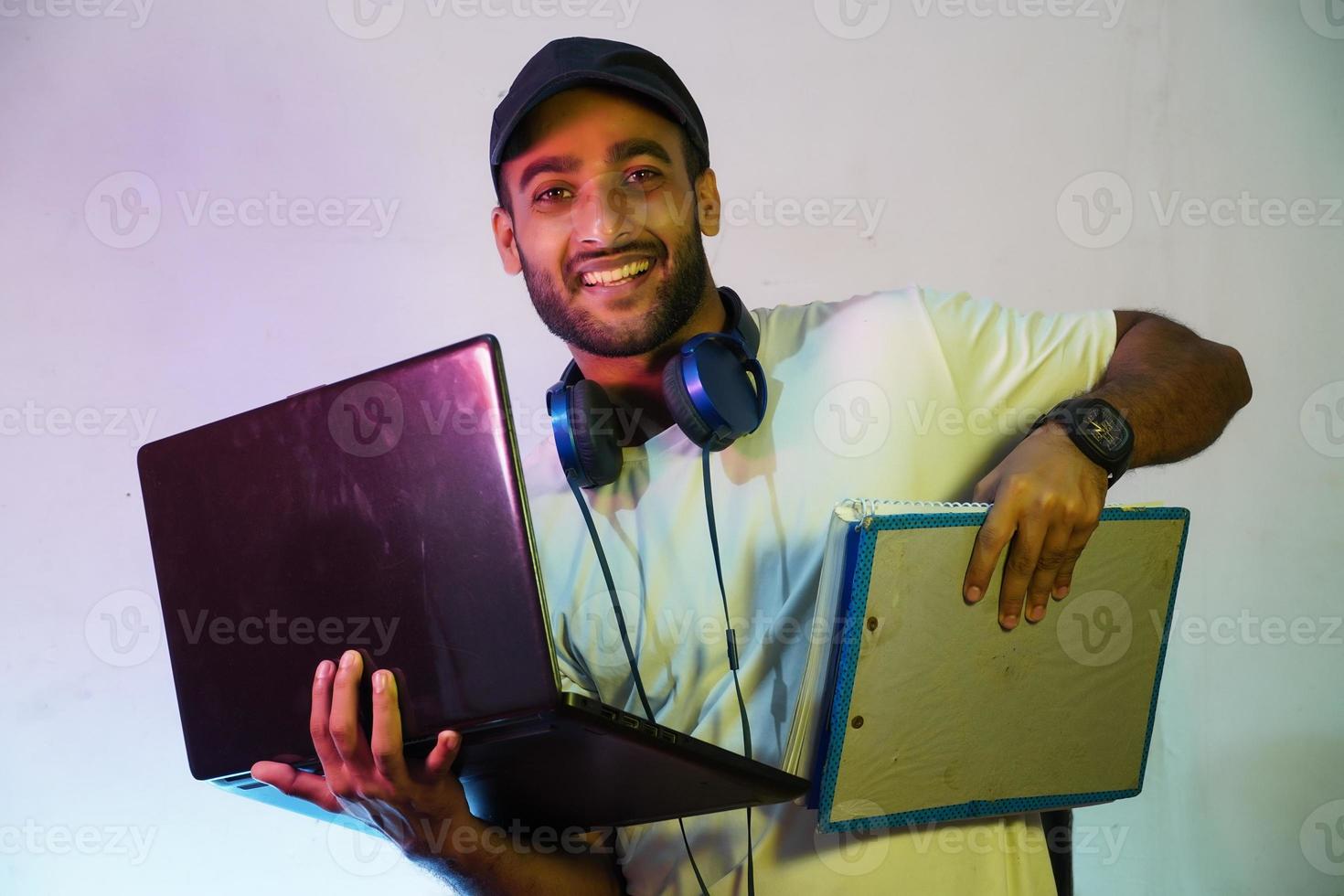 h happy student with laptop and books photo