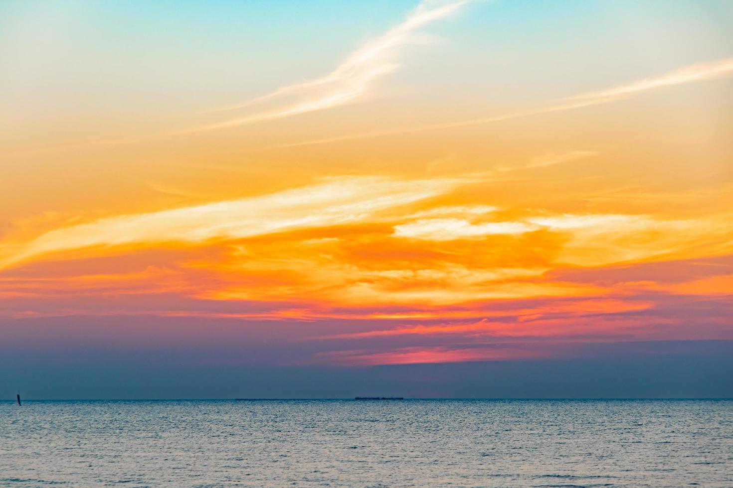 Tropical Colorful sunset over ocean on the beach. at Thailand Tourism background with sea beach. Holiday journey destination photo